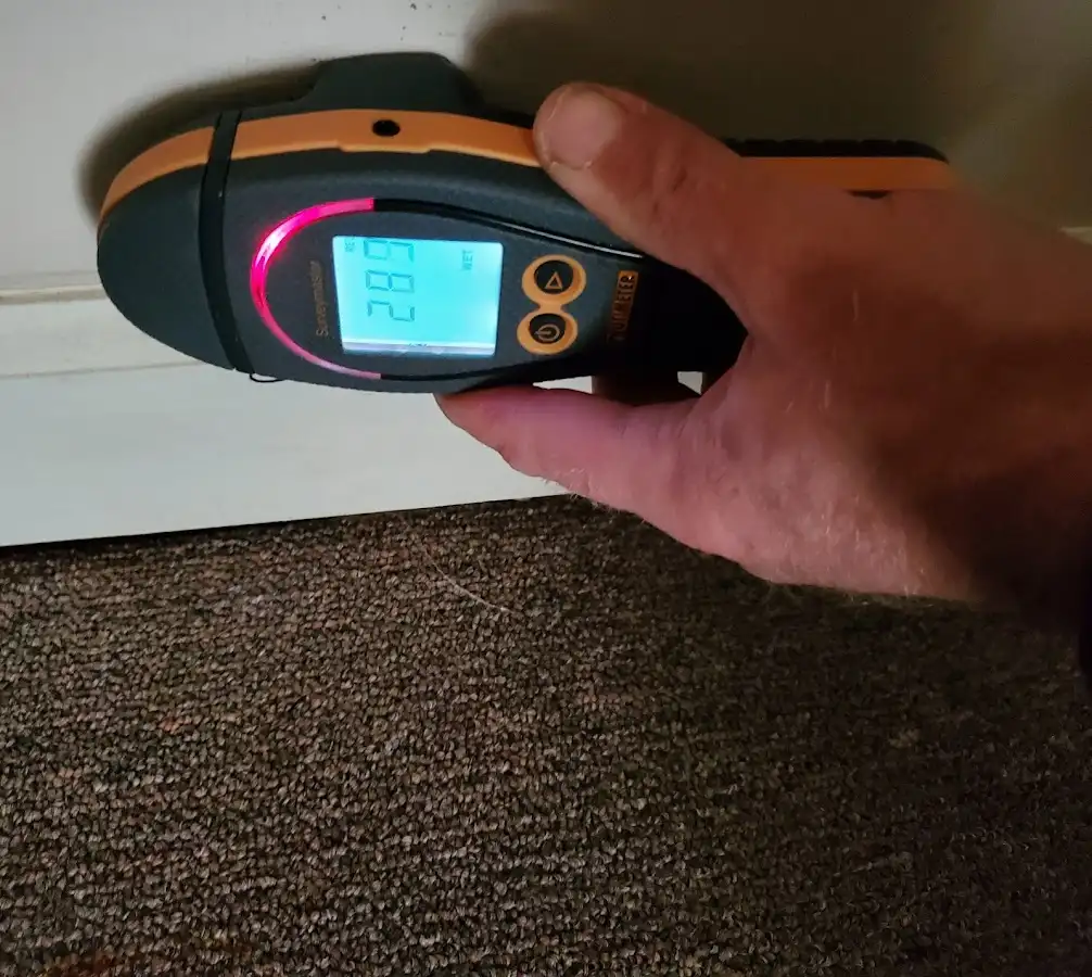 Moisture detection at baseboard during Storm Damage Restoration in South Burlington